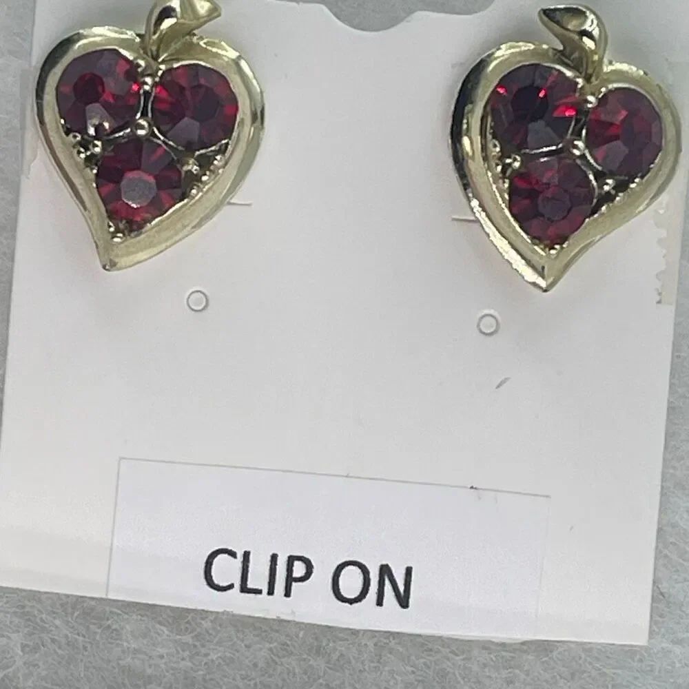 Vintage red cut glass heart shaped screwback earrings.